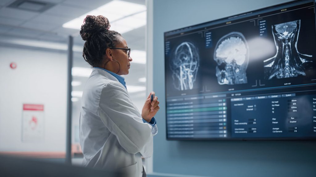 woman looking at brain scans