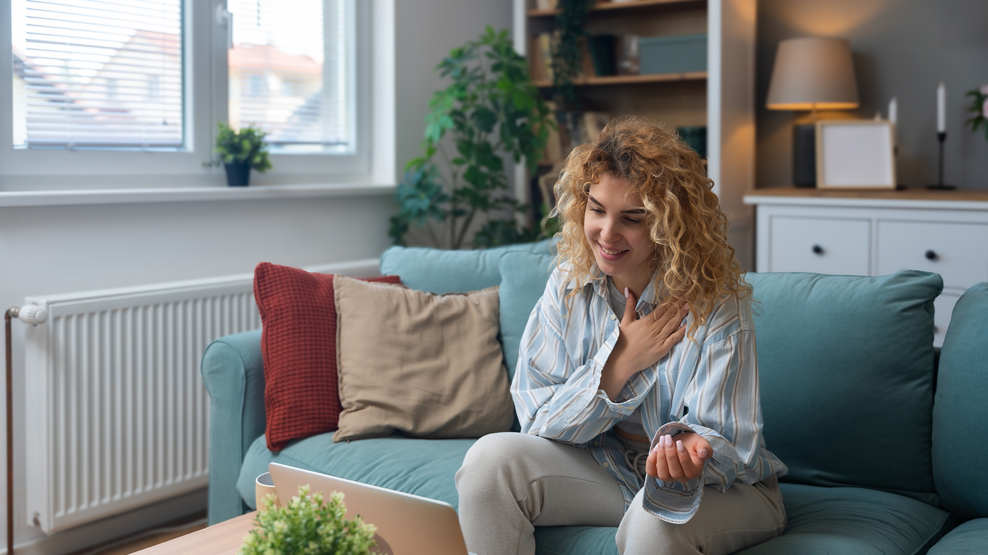 Young woman talking on video call with her psychotherapist doctor after online therapy sessions, happy that she is well and mentally health now after telemedicine conversations. 