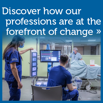 Discover how our professions are at the forefront of change. Photo of students watching a simulated medical procedure.