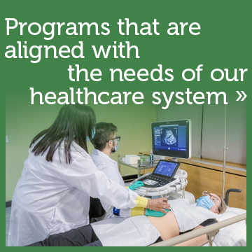 Michener develops programs that are aligned with the needs of our health care system. Photo of an ultrasound faculty member shows student how to use sonography equipment.