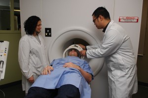 MRI Faculty and Students work on patient using simulator