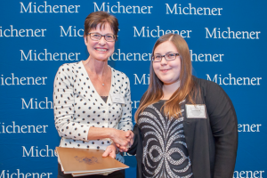 Danielle Nicole Grohn (right), winner of six Michener scholarships, including the President Award, with professor Mary Emes.