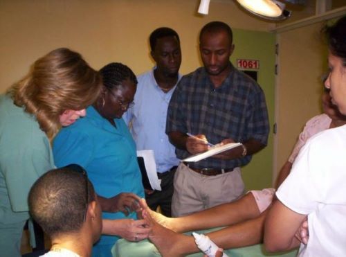 Laura Lee Kozody (Left) examines the feet of a patient at the newly founded Diabetic Foot Center in the Georgetown Public Hospital in Guyana