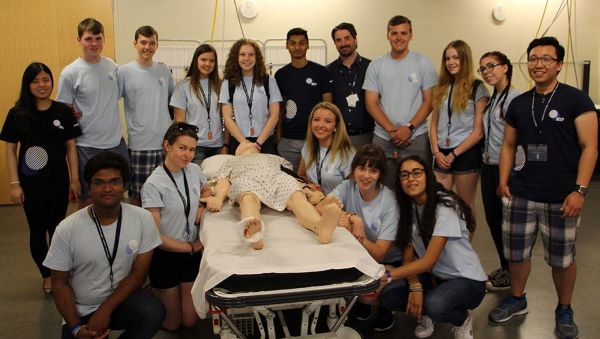 Judy Tran (far left, second row) and her DEEP Summer Academy students visit Michener’s Centre for the Advancement of Simulation Education (CASE). (Photo: UHN)