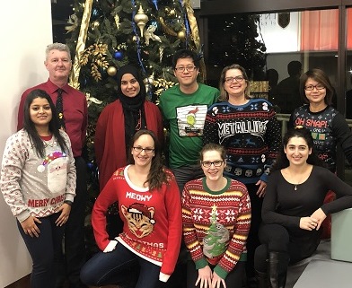 Michener Alumni Association Board of Directors in front of Christmas tree