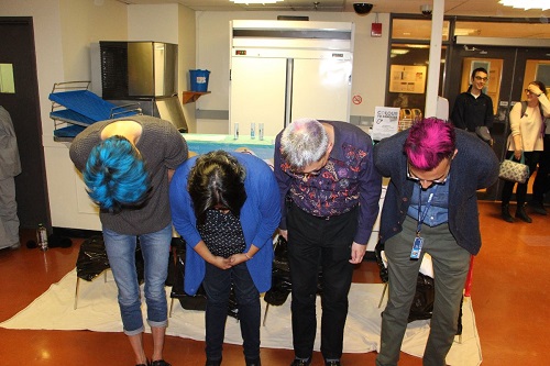 photo of faculty member bent over, showing the colour in their hair