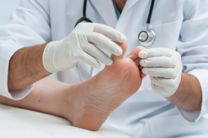 Chiropodist checking patients feet