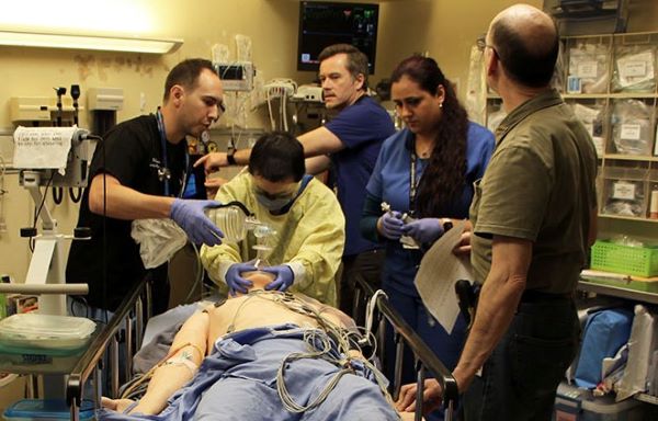 Health care team participates in simulation