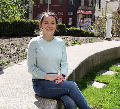 Sam sitting on Michener patio