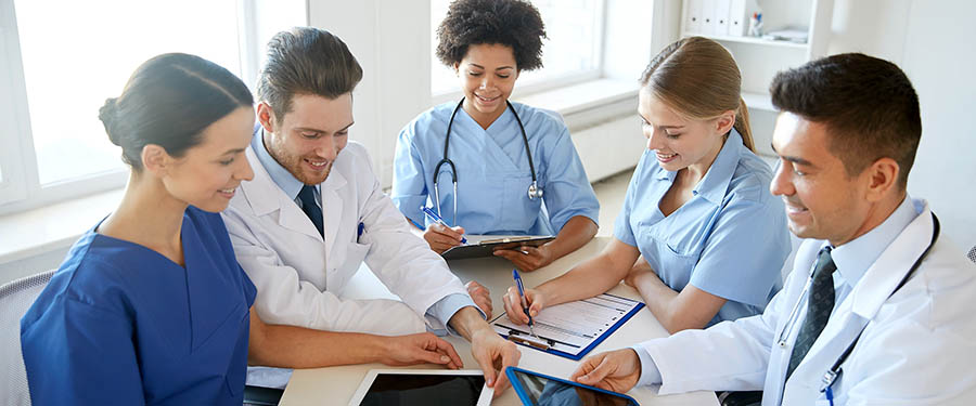 group of happy doctors meeting at hospital office