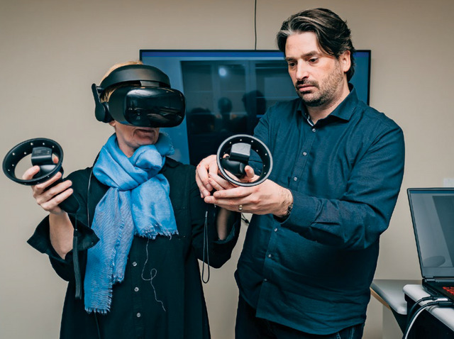 Two Michener staff using virtual reality equipment