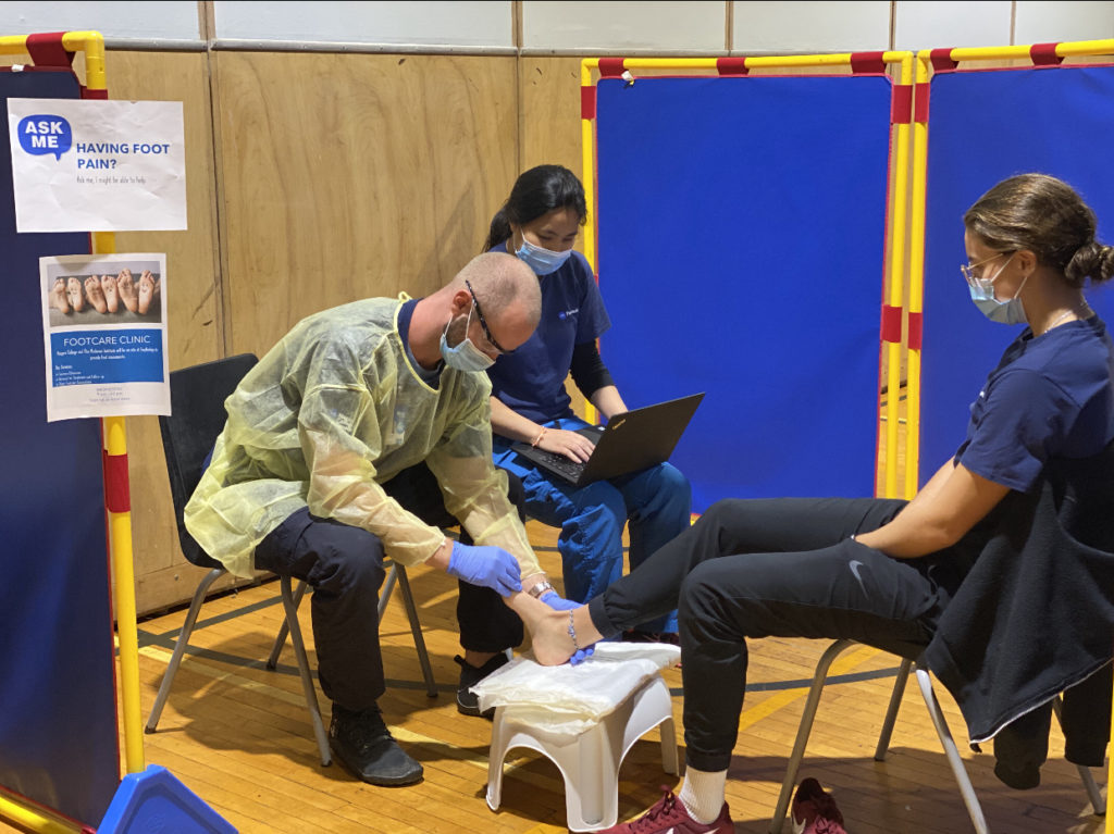 Chiropodist working on a patient's foot