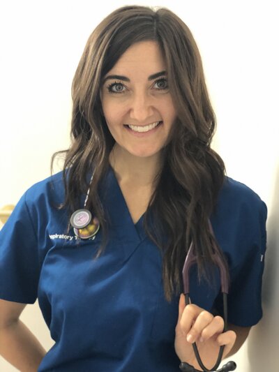 Headshot of Dr. Diana Michener Schatz Scholarship winner Kaitlyn Evers in scrubs